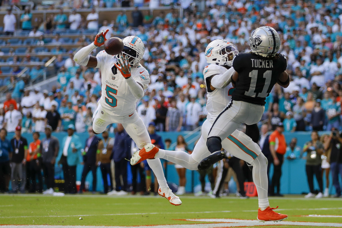 Nov 19, 2023; Miami Gardens, Florida, USA; Miami Dolphins cornerback Jalen Ramsey (5) intercepts a pass intended to Las Vegas Raiders wide receiver Tre Tucker (11) during the fourth quarter at Hard Rock Stadium. Mandatory Credit: Sam Navarro-USA TODAY Sports